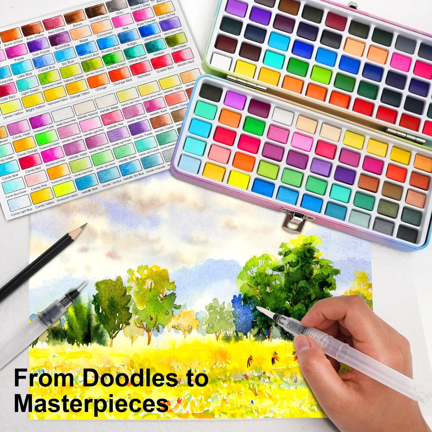 A beautiful landscape painting next to the open 100 Colors Watercolor Paint Set, perfect for creating masterpieces for artists of all levels.