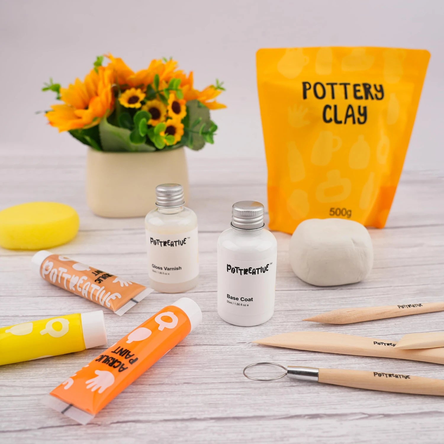 Clay, paint, and varnish for pottery crafting.