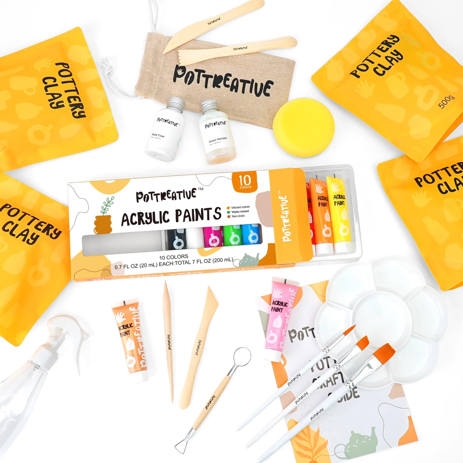 Pottery kit with acrylic paints, clay, and sculpting tools.