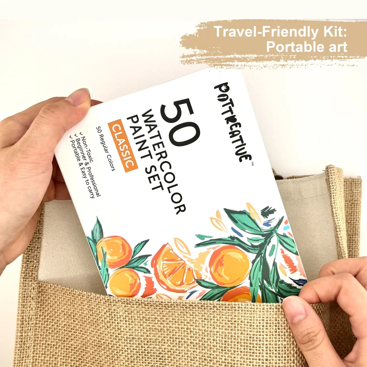 The travel-friendly 50 Colors Watercolor Paint Set box being placed in a tote bag, showing its portability for art on the go.